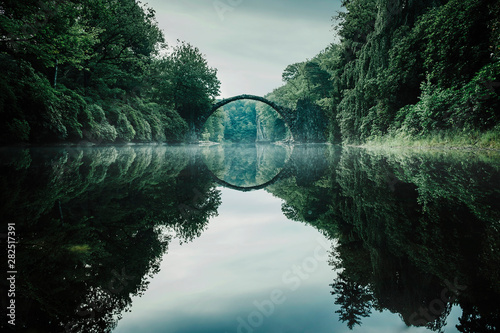 Tranquil Rakotzbruecke Devils Bridge, Rakotzbruecke, Brandenburg, Germany photo