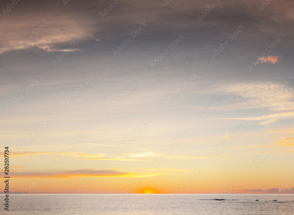 sun coming up over the sea