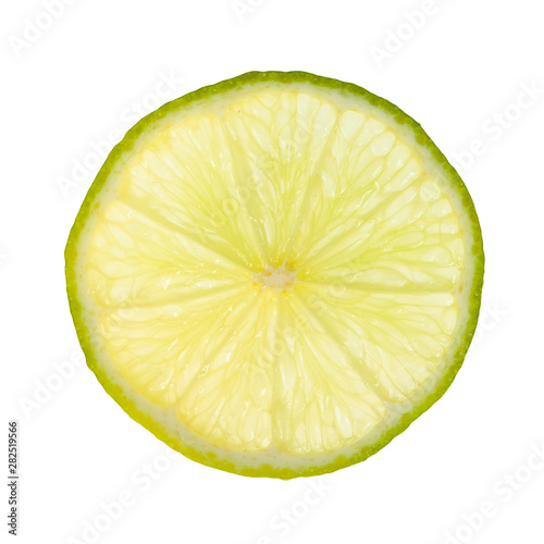 thin slice of fresh lime lit from behind isolated