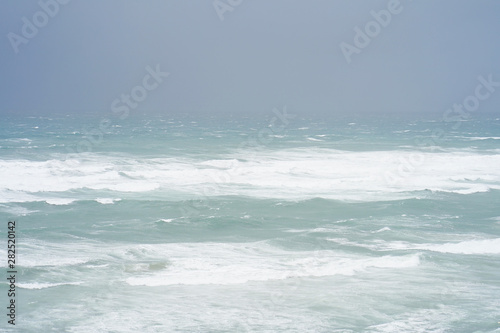 Fototapeta Naklejka Na Ścianę i Meble -  Beautiful wave on the beach. Early morning and strong wind. Sea pier large waves.