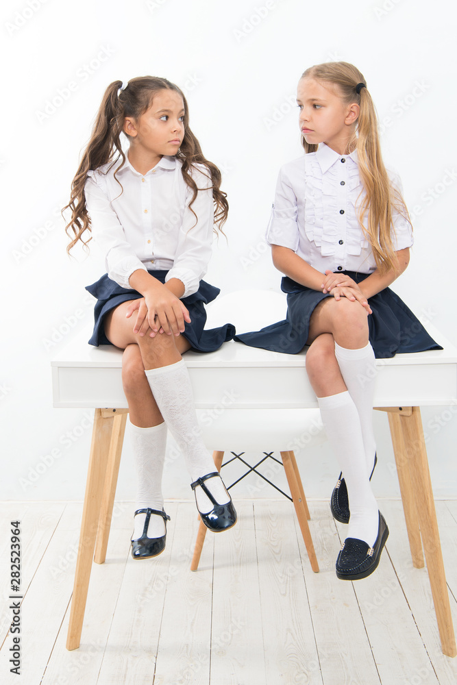 Why are you sad. Schoolgirls tidy hairstyle relaxing having rest. School uniform. School club. Little schoolgirls classmates friendly kids. Schoolgirls friends sit on desk. Best friends relaxing Stock Photo | Adobe Stock Why are you sad. Schoolgirls tidy hairstyle relaxing having rest. School uniform. School club. Little schoolgirls classmates friendly kids. Schoolgirls friends sit on desk. Best friends relaxing Stock Photo | Adobe Stock