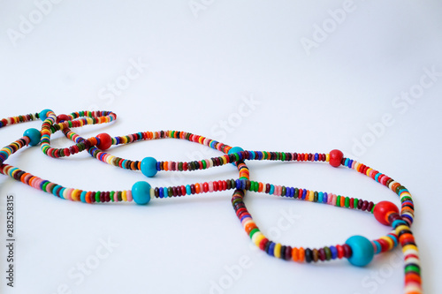 dna shape of bright colorful beauty beads necklace isolated on white background
