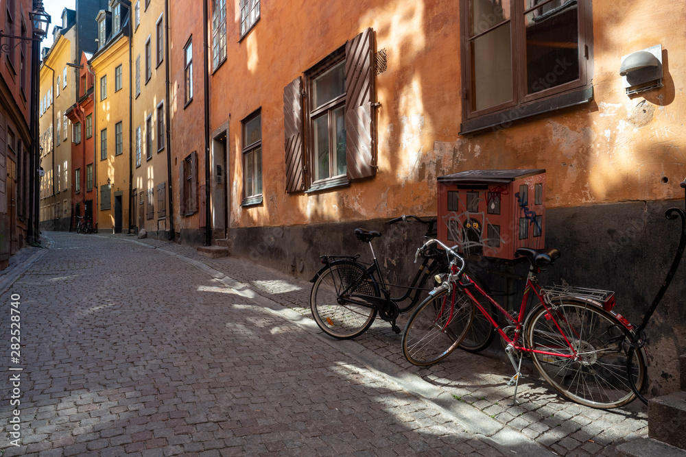 Bicycles are in a narrow street