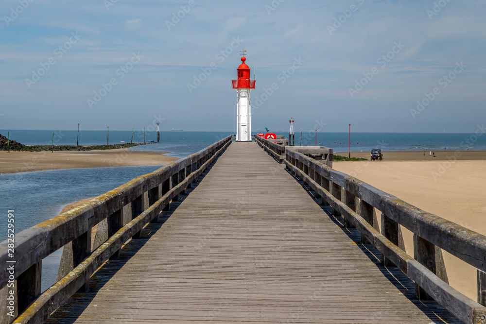 Red lighthouse in Trouville, resort in Normandy, France.