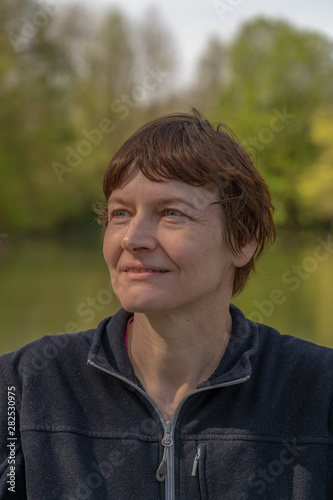 Alençon, France - 04 22 2019: Navigation on the river Sarthe. Girl sitting on a boat