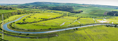 Panoramic view of high and over side road view point near Seaford, East Sussex, England. View of Cuckmere river from above, selective focus