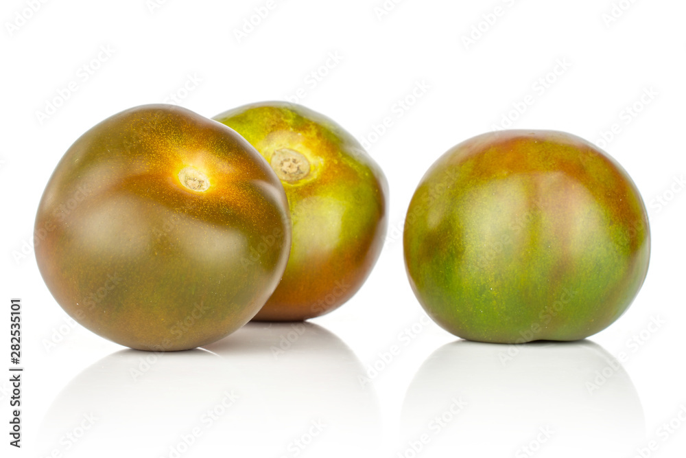 Group of three whole round fresh greenish red tomato isolated on white background Group of three whole round fresh greenish red tomato isolated on white background