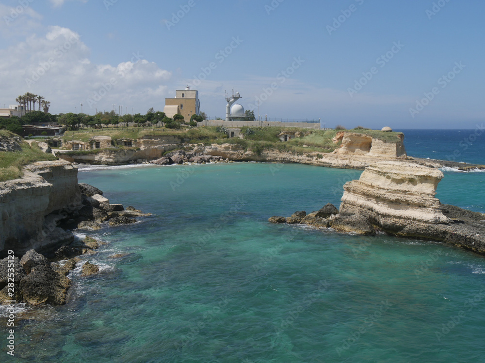 Lighthouse owned by the Navy and touistic village of Torre Sant'Andrea in Salento.