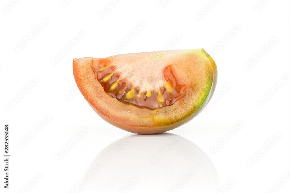 One slice of fresh greenish red tomato isolated on white background One slice of fresh greenish red tomato isolated on white background