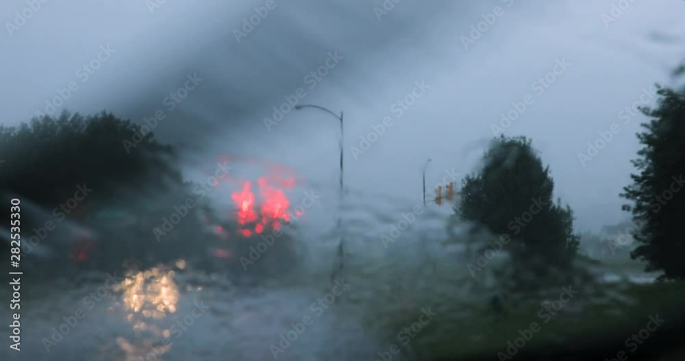 Point of view driver driving in a rain storm Point of view driver driving in a rain storm