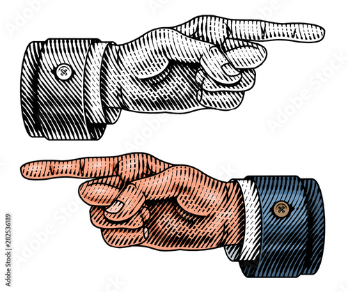 Pointing male hand. Engraved Forefinger directs. Sketch in vintage retro style. Close up arm gesture in monochrome style. Business concept for web site or label.