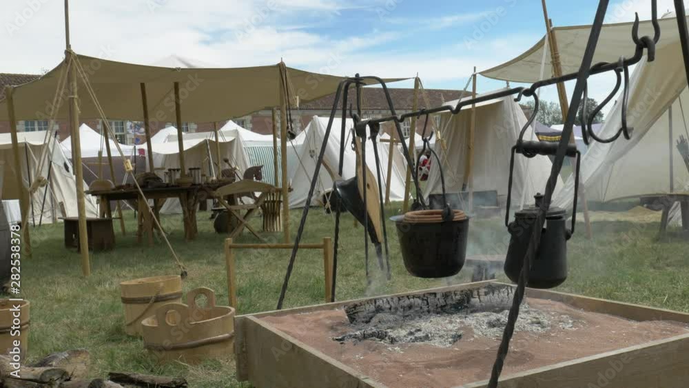 Static shot of a smoking fireplace in a 18th century reenactment camp. Static shot of a smoking fireplace in a 18th century reenactment camp.