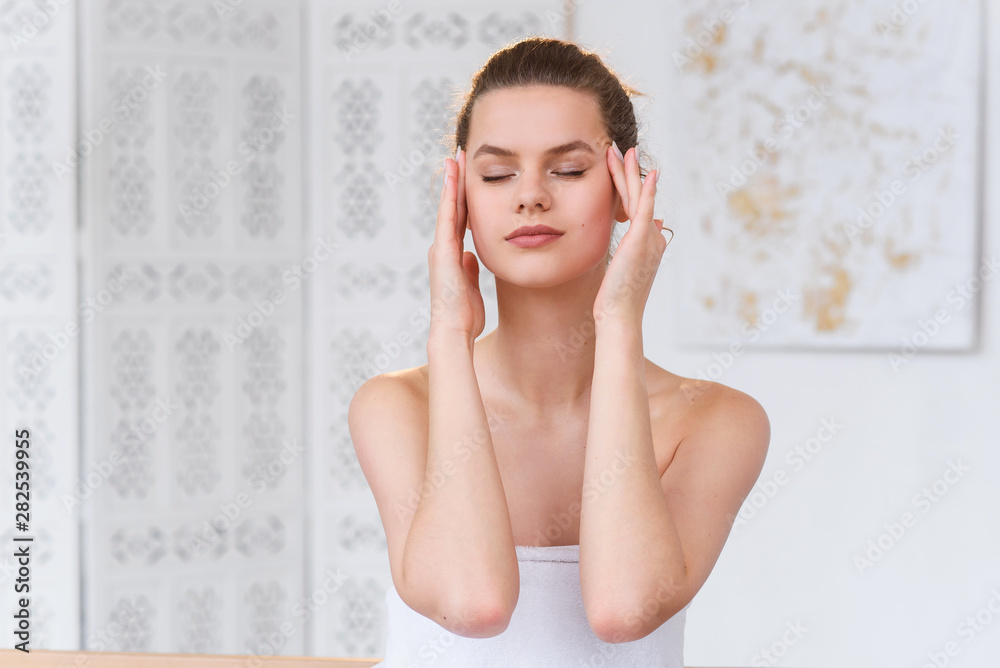 Stressed woman has a strong headache. Close up portrait of beautiful girl suffering from head migraine. Feeling pressure and stress. Stressed woman has a strong headache. Close up portrait of beautiful girl suffering from head migraine. Feeling pressure and stress.