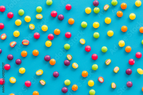 Sweets pattern on blue background top view