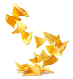 Flying delicious Mexican nachos chips on white background
