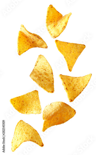 Ceramic bowl of Mexican nachos chips on white background photo