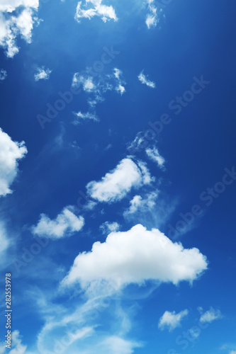 Abstract nature background of Tropical summer blue sky with puffy   fluffy white cloud in morning sunlight at island beach. Close up of Clear dark blue sky with small cloud 