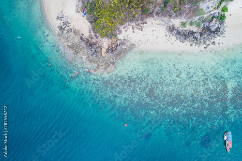 Aerial view on the sea and boat or speedboat. Beautiful natural seascape at the summer time. Island and beautiful beach. blue seascape © Love You Stock