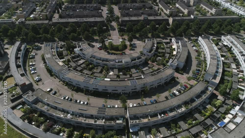 Drone Slowmotion of a Dutch Modern Neighborhood in Zoetermeer. Family Houses surrounded by Trees, during Sunny Weather Drone Slowmotion of a Dutch Modern Neighborhood in Zoetermeer. Family Houses surrounded by Trees, during Sunny Weather