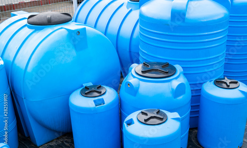 blue plastic barrels for drinking water, liquid storage tanks