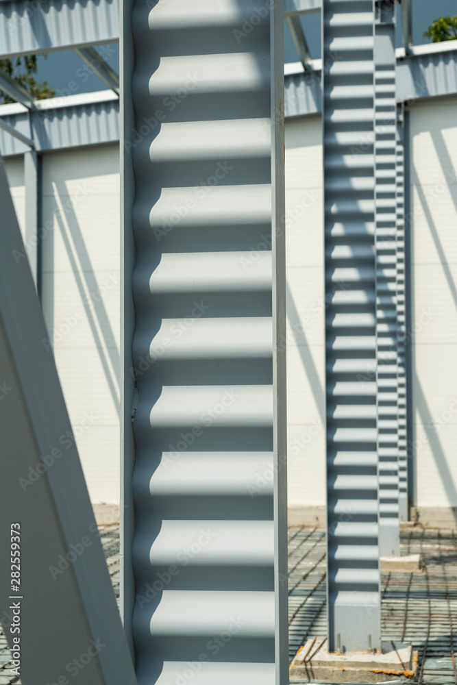 Naklejka premium metal poles for building construction, industrial building frame, reinforcement