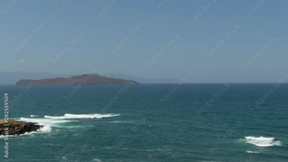 Sea view with a small island in the background Sea view with a small island in the background