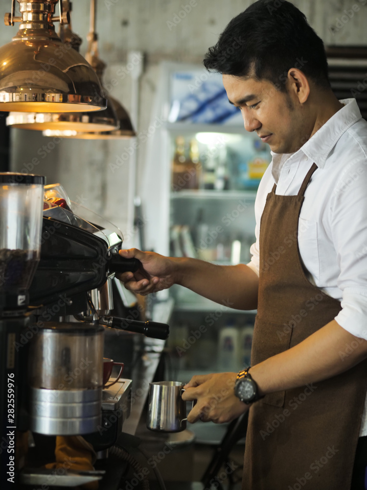 Happy Asian barista man working in cafe, lifestyle concept. Happy Asian barista man working in cafe, lifestyle concept.