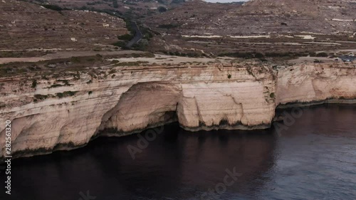 Aerial Shot flying towards a small Cave in Dingli Cliffs