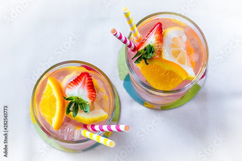 colorful fruit lemonade in glasses photo