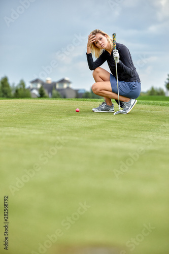 Goal concept, copy space. Women golfing time holding golf equipment on green field background. The pursuit of excellence, personal craftsmanship, royal sport, sports banner.