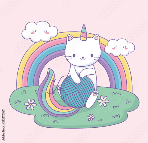 cute cat with rainbow tail and wool ball kawaii character