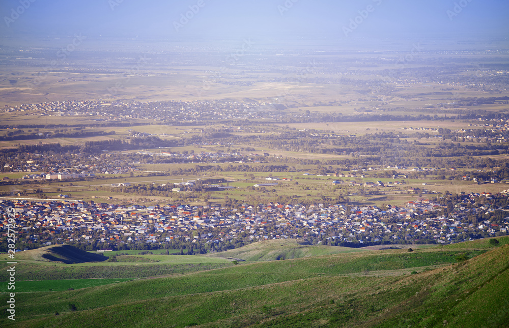 High angle view onto the green fields and villages