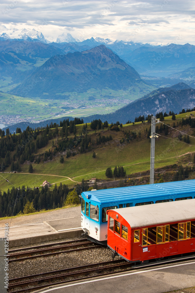 Rigi kulm train in Switzerland, tourist transportation to mountain in Lucerne Rigi kulm train in Switzerland, tourist transportation to mountain in Lucerne