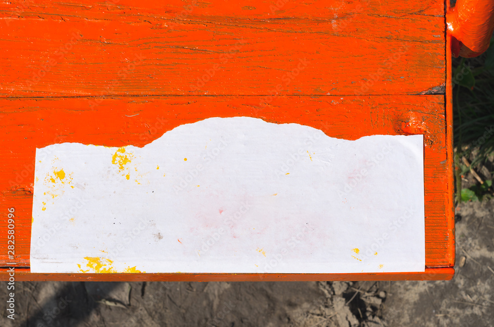 Fototapeta premium Blank Paper Sign on Orange Timber Swing Seat Mock Up.