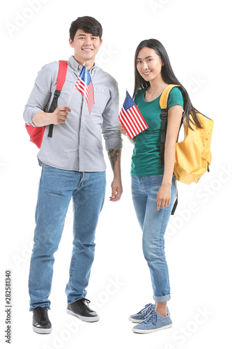 Asian students with USA flags on white background