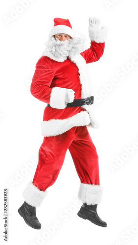 Portrait of jumping Santa Claus on white background