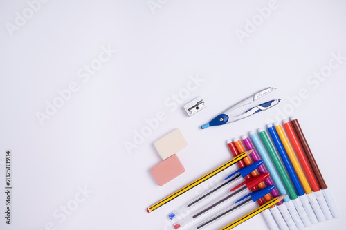 school supplies. pencil rubber pens compass and marker pens