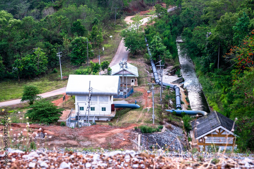 Water pumping stations with big water pipe and canal along the country road in Chiang Mai, Thailand.