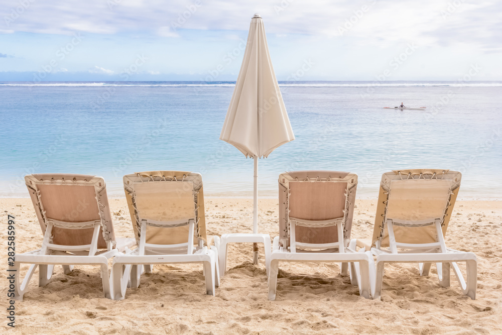 chairs and umbrella on the beach, Réunion Island 