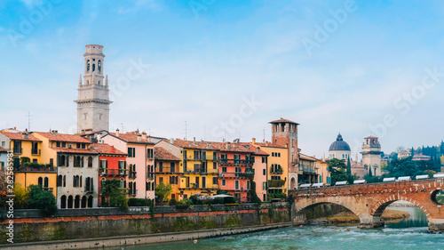 Roman arch bridge over Adige River in Verona. Historical center of European city. Romantic sightseeng trip to Italy