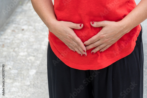 Stomach ache. Woman with menstrual pain. Selective focus