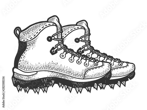 Climber hiking boots with spikes sketch engraving vector illustration. Scratch board style imitation. Black and white hand drawn image.