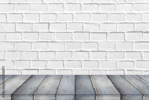 Wooden Shelf or Table in front of clean empty white brick Wall with space for Text or Ideas 