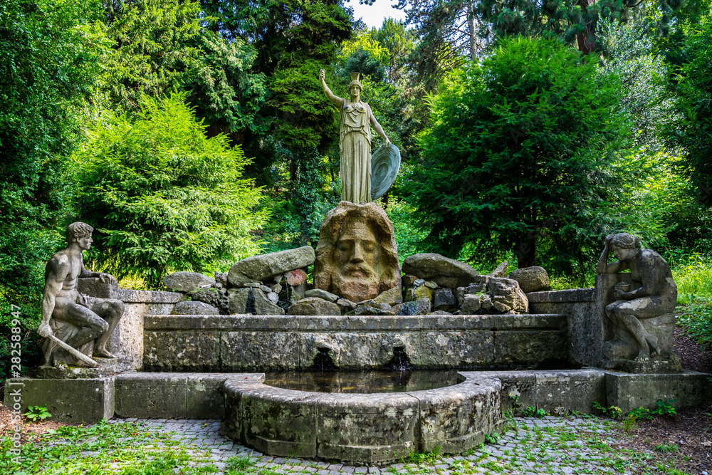 Germany, Ancient famous spring called athenenbrunnen with sculptures of zeus, prometheus and pandora in public park of stuttgart city near karslhoehe