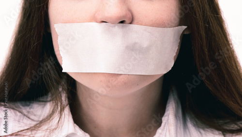 Beautiful girl with the mouth closed, the white ribbon