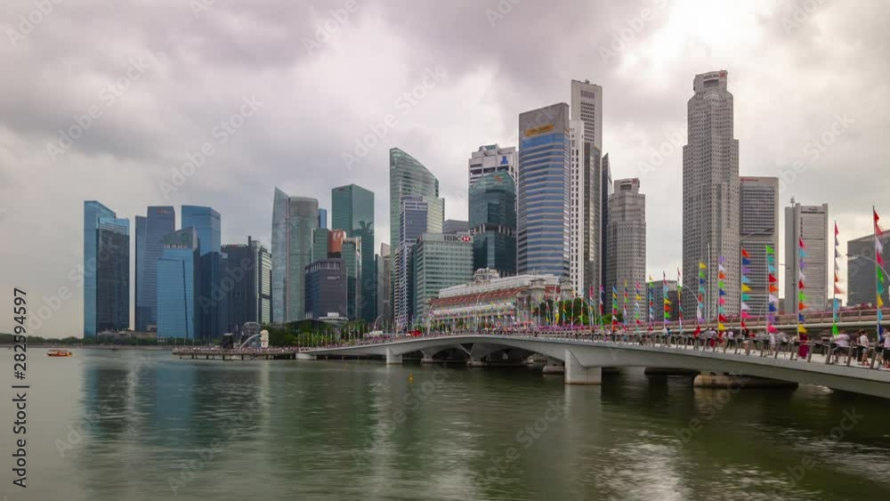 cloudy sky singapore city downtown marina bay famous pedestrian bridge panorama timelapse 4k cloudy sky singapore city downtown marina bay famous pedestrian bridge panorama timelapse 4k