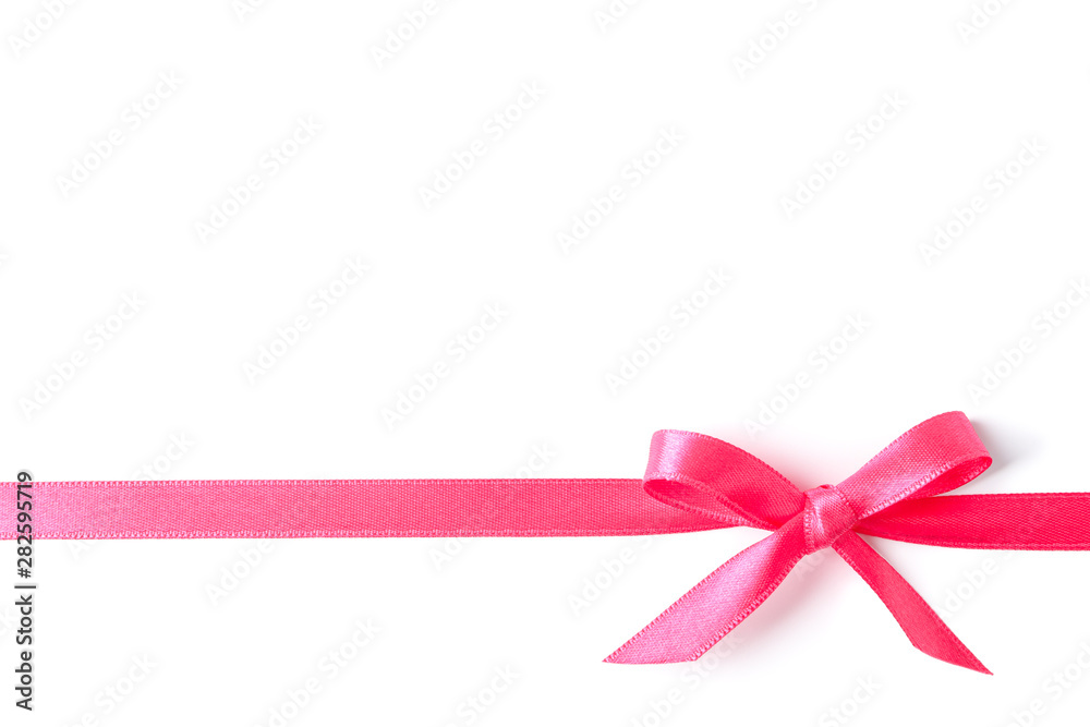 Pink ribbon with bow isolated on white background. Gift concept Pink ribbon with bow isolated on white background. Gift concept