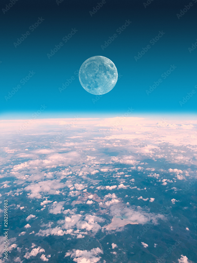 Obraz premium Half Moon rising from the Earth horizon above the clouds. My astronomy work.