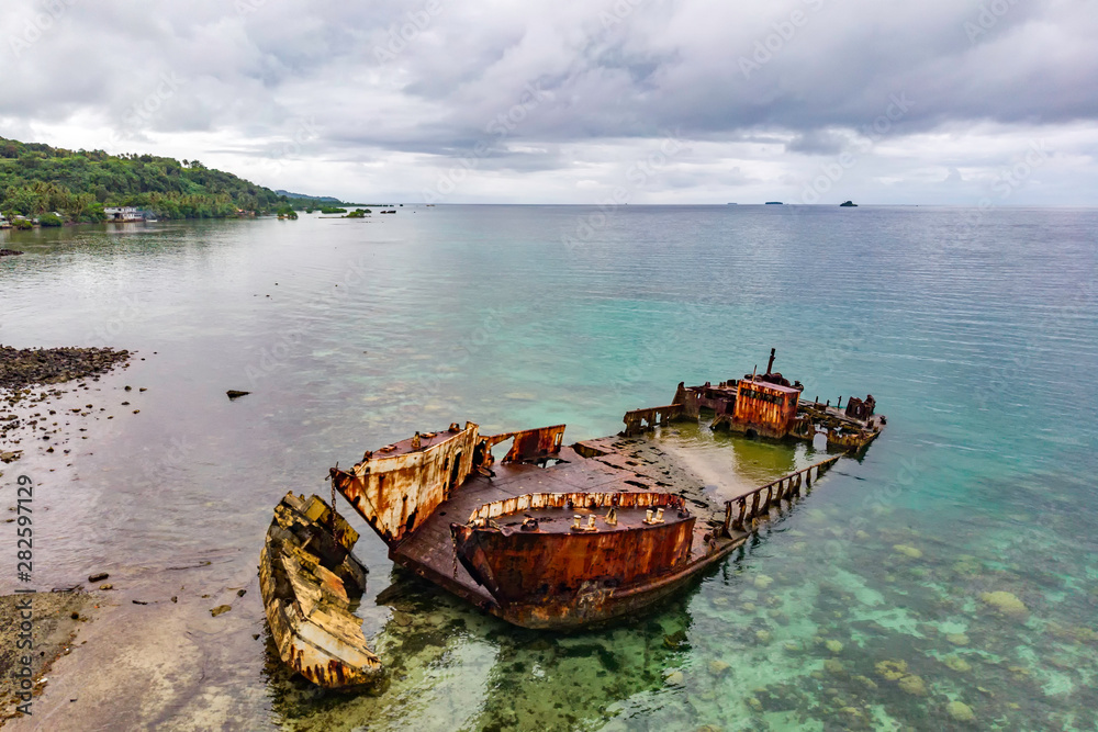 Shipwreck of Ferry in Shallow Water on a Tropical Island