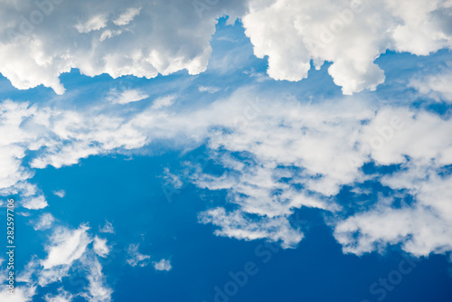 Beautiful white clouds on the blue sky as nature background © Pavlo Vakhrushev